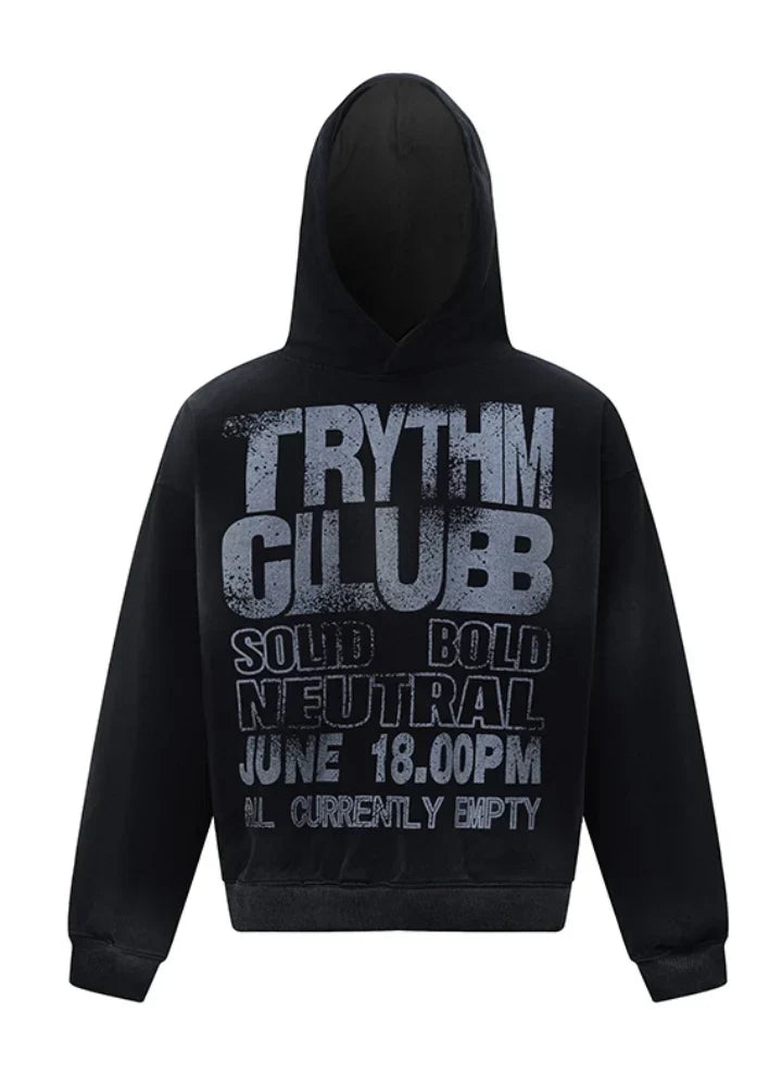 黒のキャンバス パーカー。太字で「TRYTHM CLUBB」と書かれており、グレーの文字サイズが異なる「SOLID」、「BOLD」、「NEUTRAL」、「JUNE 18 00PM」、「ALL CURRENTLY EMPTY」が書かれています。.